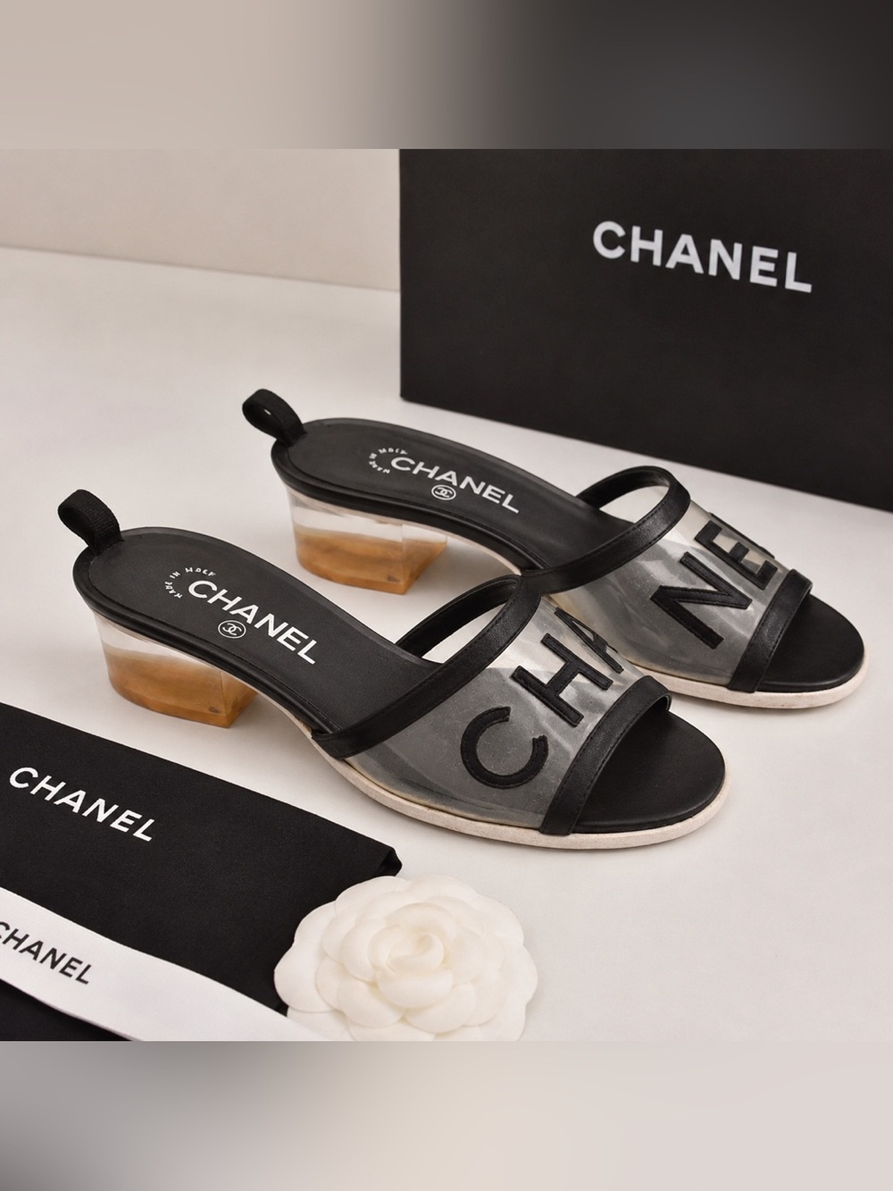 CHANEL Black and Clear Logo Slip-On Mules
